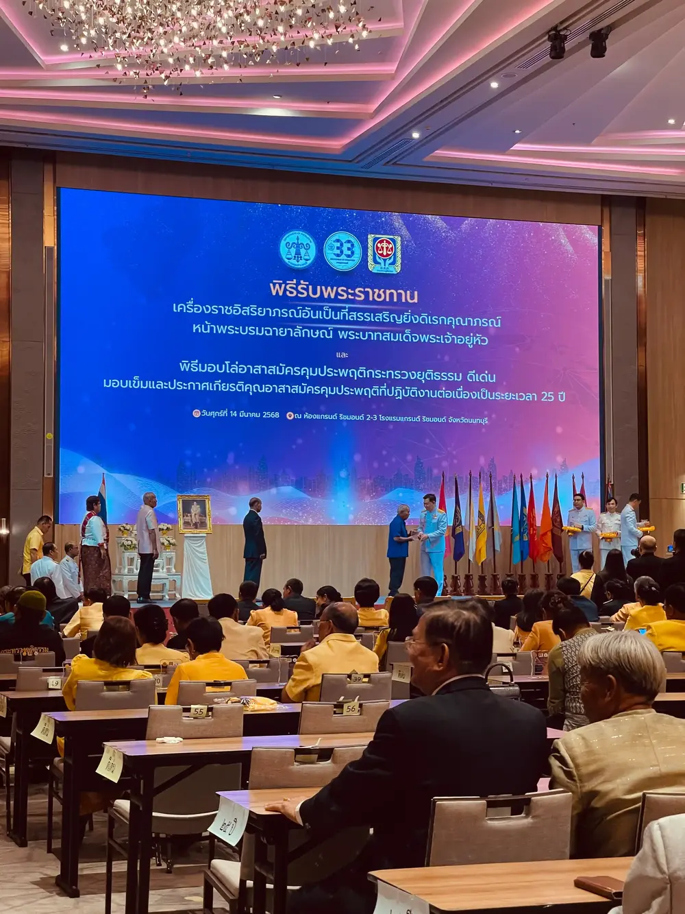 Double-height booth with LED column